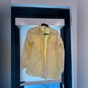 Yellow button down shirt
